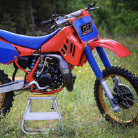 Set of three custom racing number stickers with name and flag for dirt bikes, motocross, and motorcycles by MC Motoparts.