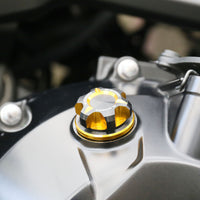 CNC oil filler cap for Triumph Tiger 1200, Daytona 900, Trident, and 660 T-Axis motorcycles by MC Motoparts, metallic finish.