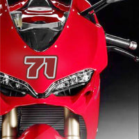 Custom racing number stickers from MC Motoparts, vintage American style, shown applied to a dirt bike or motorcycle.