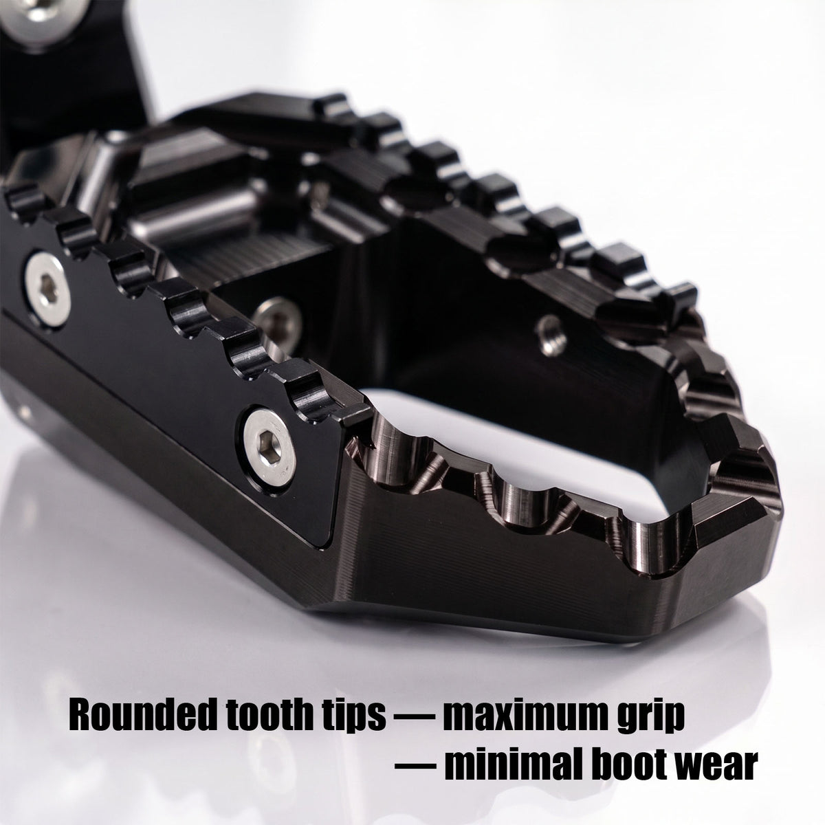 Black 40mm extension foot pegs for Honda CB1000R, CB600F, CB900F, and TRC touring models by MC Motoparts, adjustable for rider comfort.