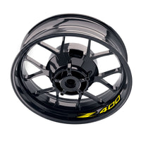 Kawasaki Z400 inner rim sticker set by StickerBao, bike-specific wheel decals with yellow accents on black rims.